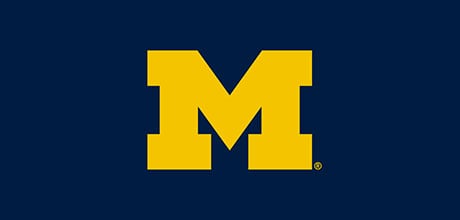 Yellow 'M' logo on a navy blue background.